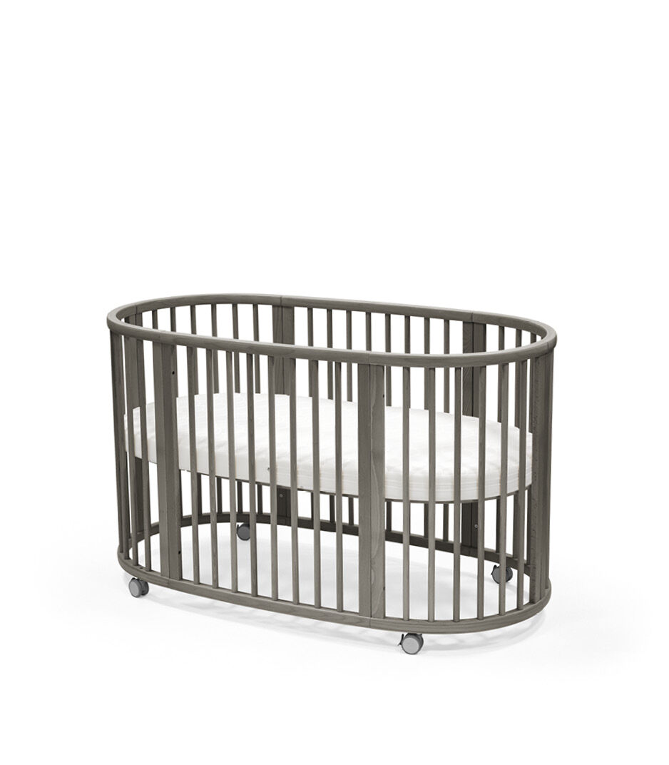 Stokke® Sleepi™ Bed, Hazy Grey. With Mattress. Closed.