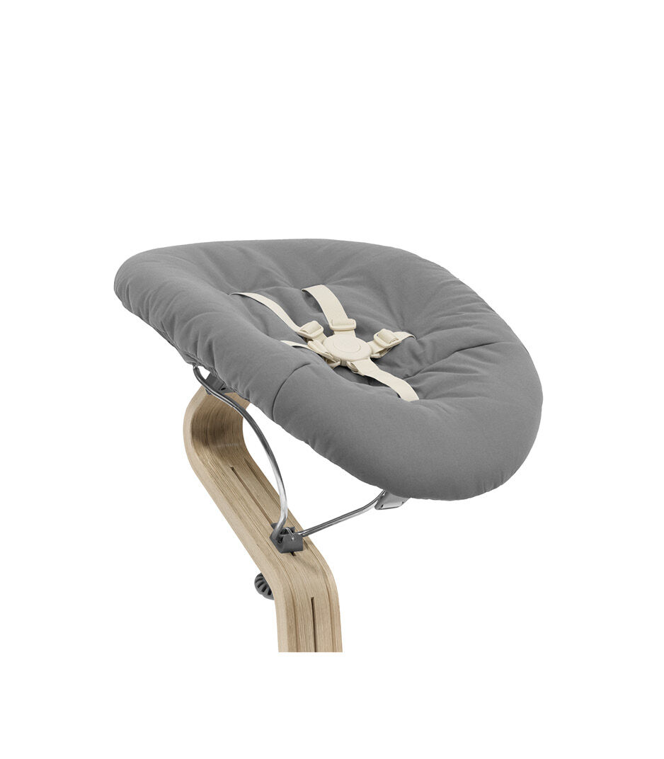 Stokke® Nomi® Chair Natural-Grey with Newborn Set Grey. Close-up.