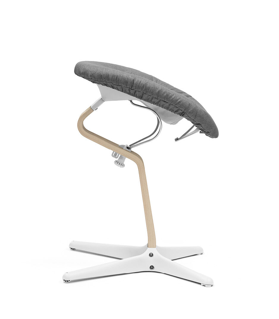 Stokke® Nomi® Chair Natural-White with Newborn Set White and Grey textile set. Active position. galery image 9