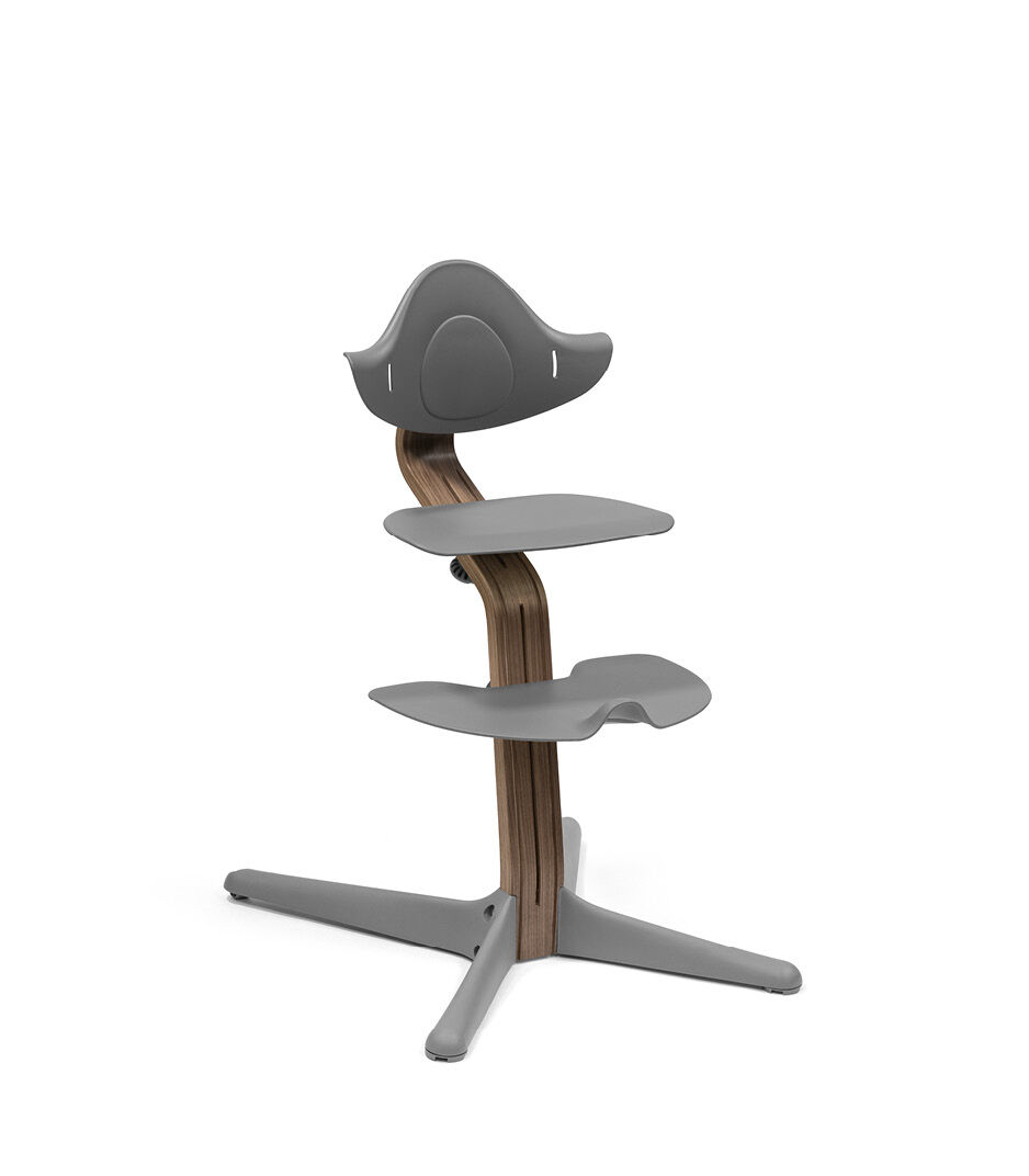 Stokke® Nomi® Chair. Premium Walnut wood and Grey plastic parts.