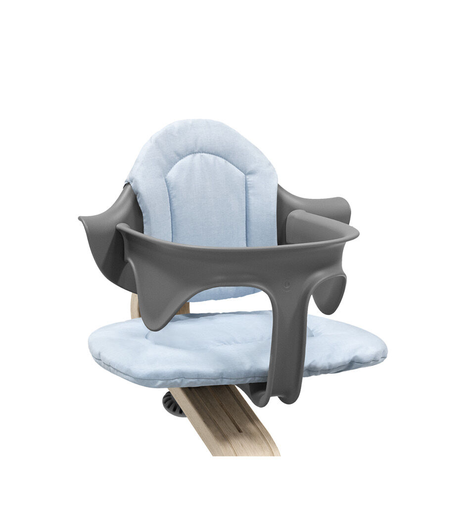 Stokke® Nomi® Chair Natural-Grey with Baby Set and Blue Cushions. Close-up.