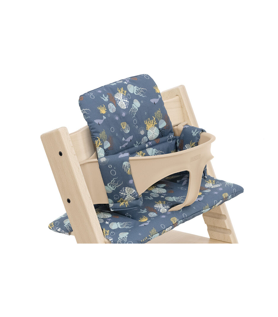 Tripp Trapp® Chair Natural with Baby Set and Classic Cushion Into The Deep. Detail.