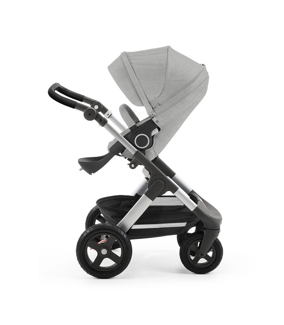 Stokke&reg; Trailz&trade; with silver chassis and Stokke&reg; Stroller Seat, Grey Melange. Leatherette Handle. Terrain Wheels.