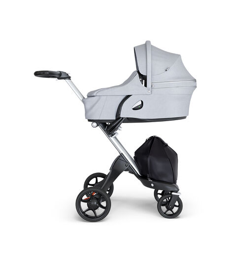 Stokke® Xplory® wtih Silver Chassis and Leatherette Black handle. Stokke® Stroller Carry Cot Grey Melange. view 2