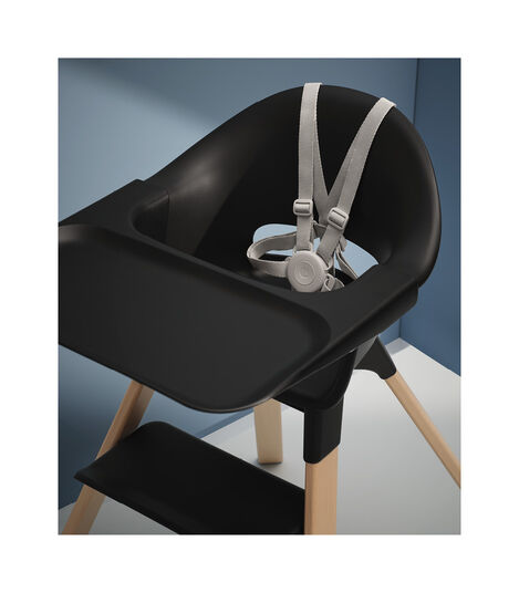 Stokke® Clikk™ High Chair Black with Natural Beech legs. Styled. view 4