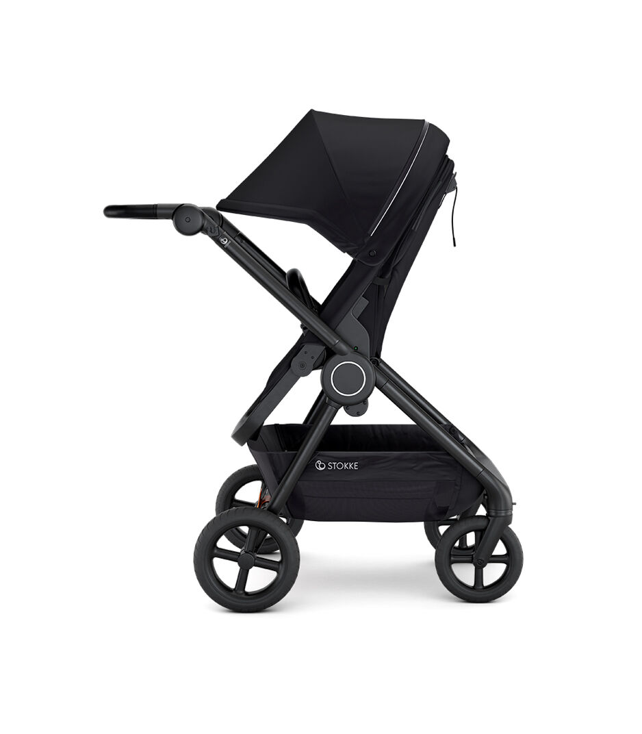 Stokke® Beat™ with Seat. Black. Parent facing. Extended Canopy.