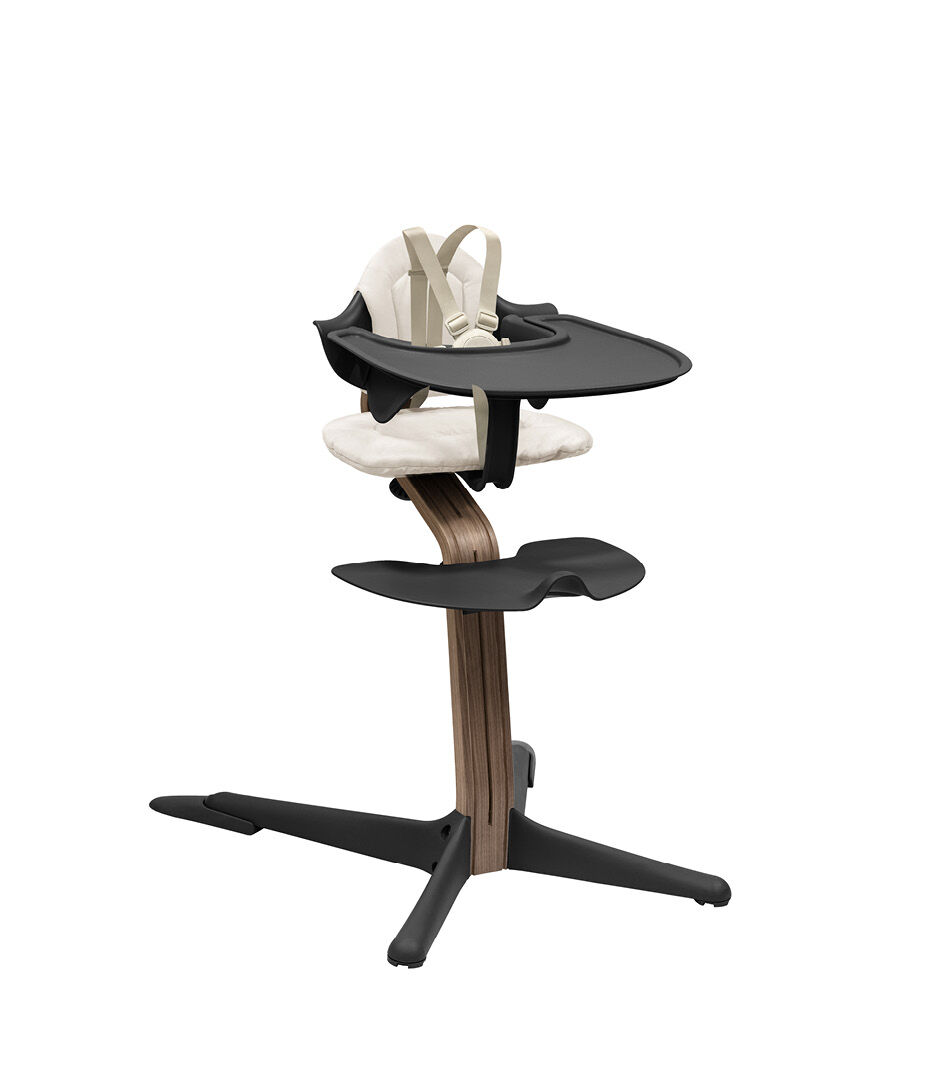 Stokke® Nomi® Chair. Premium Walnut wood and Black plastic parts. With Baby Set and Tray; Black. Cushion Sand. US variant with harness and leg extensions. galery image 13