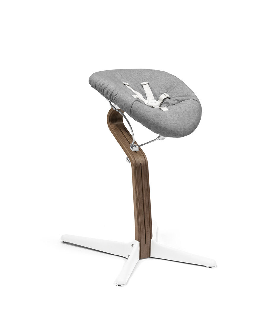 Stokke® Nomi® Chair. Premium Walnut wood and White plastic parts with Newborn Set, Grey textile cover. galery image 2