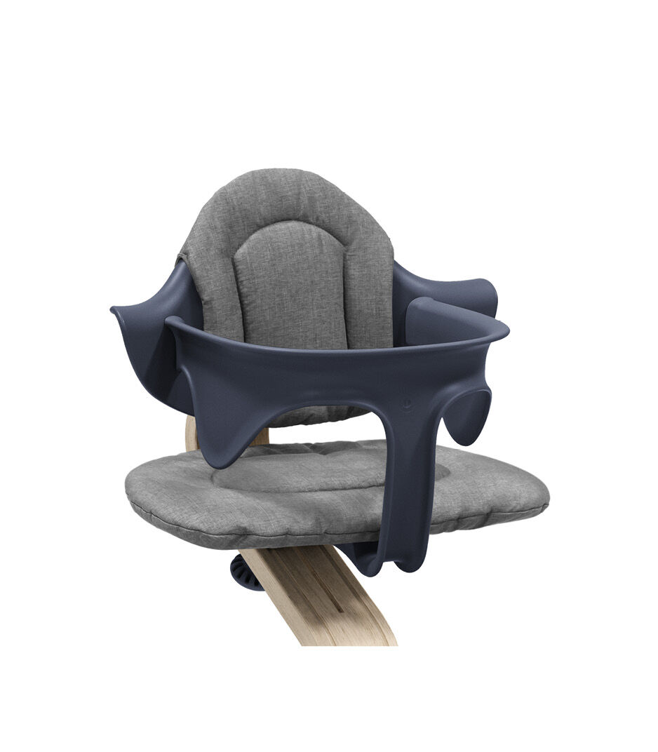 Stokke® Nomi® Chair Natural-Navy with Baby Set and Grey Cushions. Close-up.