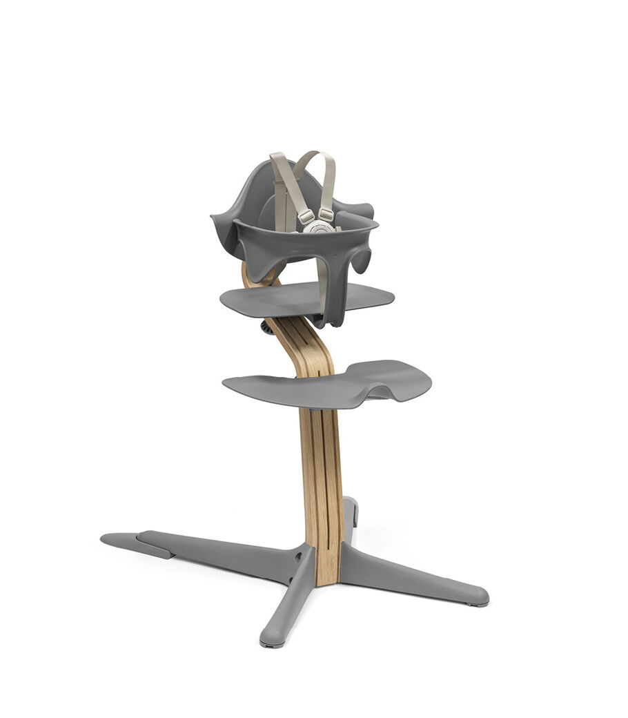 Stokke® Nomi® Chair. Premium Oak wood and Grey plastic parts. With Baby Set Grey. US variant w/Harness. view 10