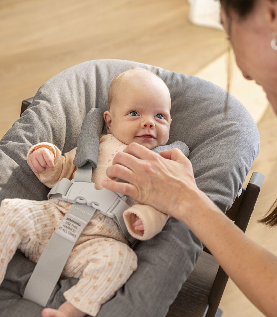 Tripp Trapp® Oak Warm Brown with Tripp Trapp® Newborn Set, Grey. Close-up.