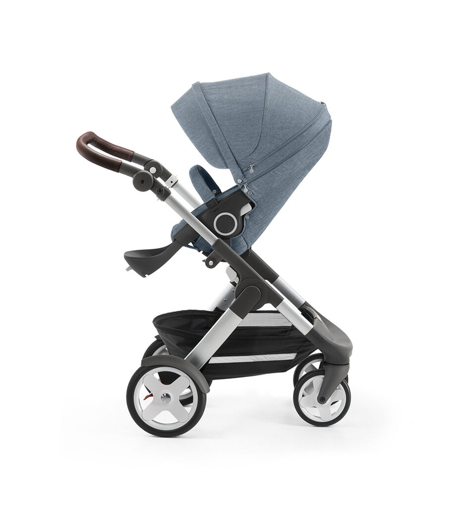 Stokke&reg; Trailz&trade; with silver chassis and Stokke&reg; Stroller Seat, Urban Blue. Classic Wheels.