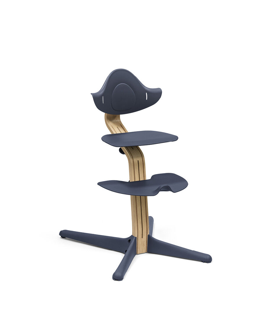 Stokke® Nomi® Chair. Premium Oak wood and Navy plastic parts. 