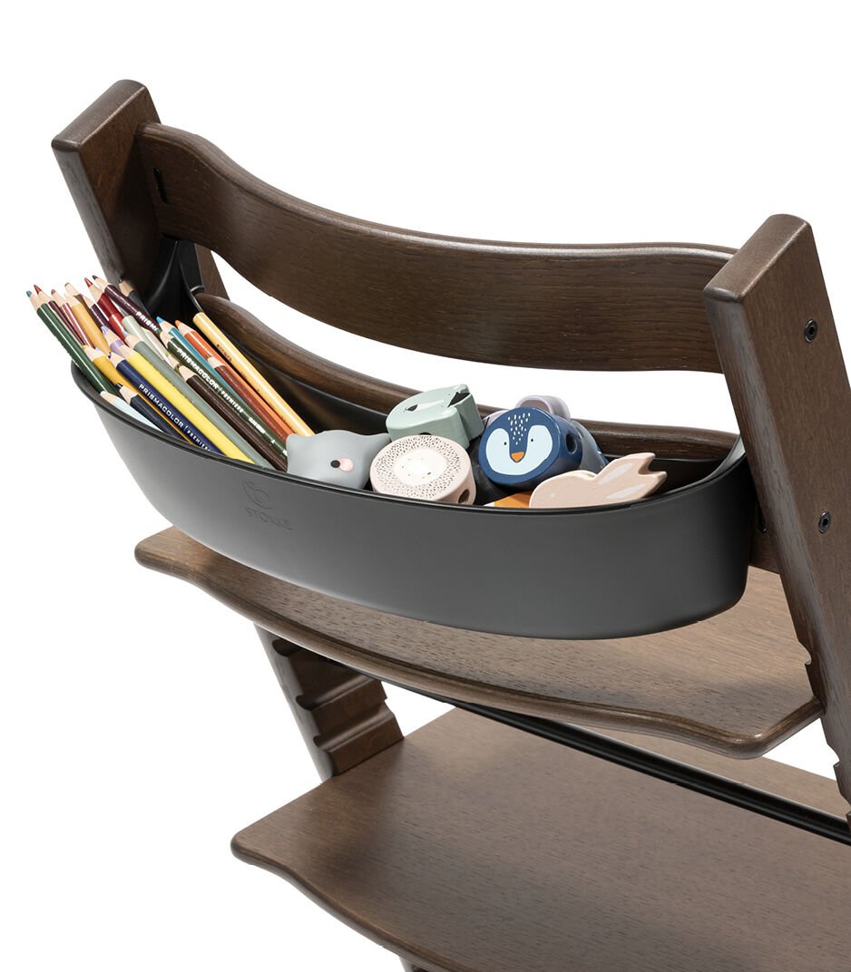Tripp Trapp® Oak Warm Brown. Storage Black with toys.