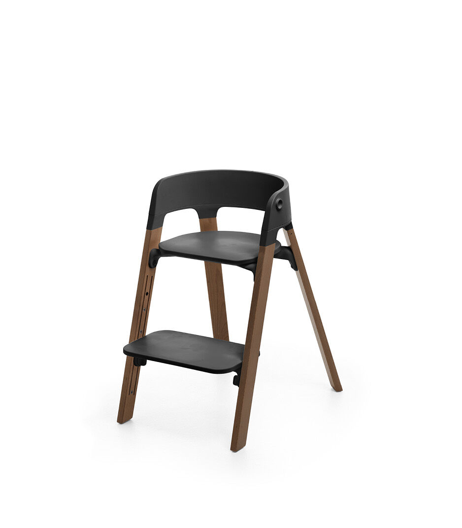 Stokke® Steps™ Chair, Golden Brown with Black Seat. Footrest low.