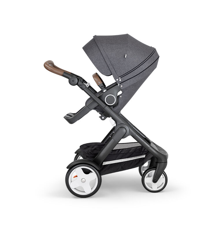 Stokke&reg; Trailz&trade; with Black Chassis, Brown Leatherette and Classic Wheels. Stokke&reg; Stroller Seat, Black Melange.