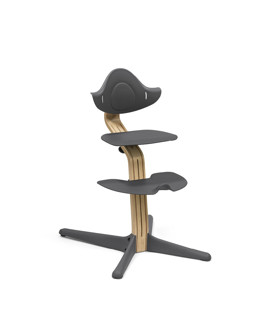 Stokke® Nomi® Chair. Premium Oak wood and Anthracite plastic part. 
