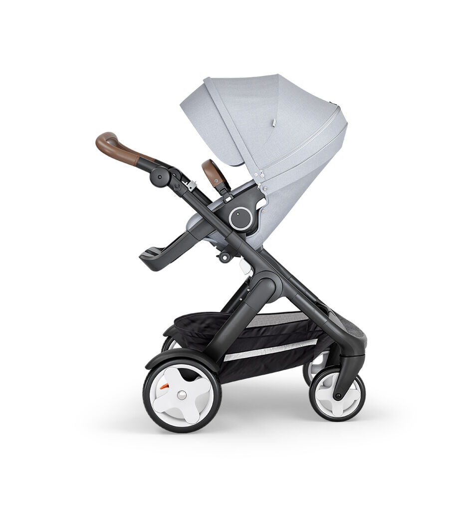 Stokke&reg; Trailz&trade; with Black Chassis, Brown Leatherette and Classic Wheels. Stokke&reg; Stroller Seat, Grey Melange.