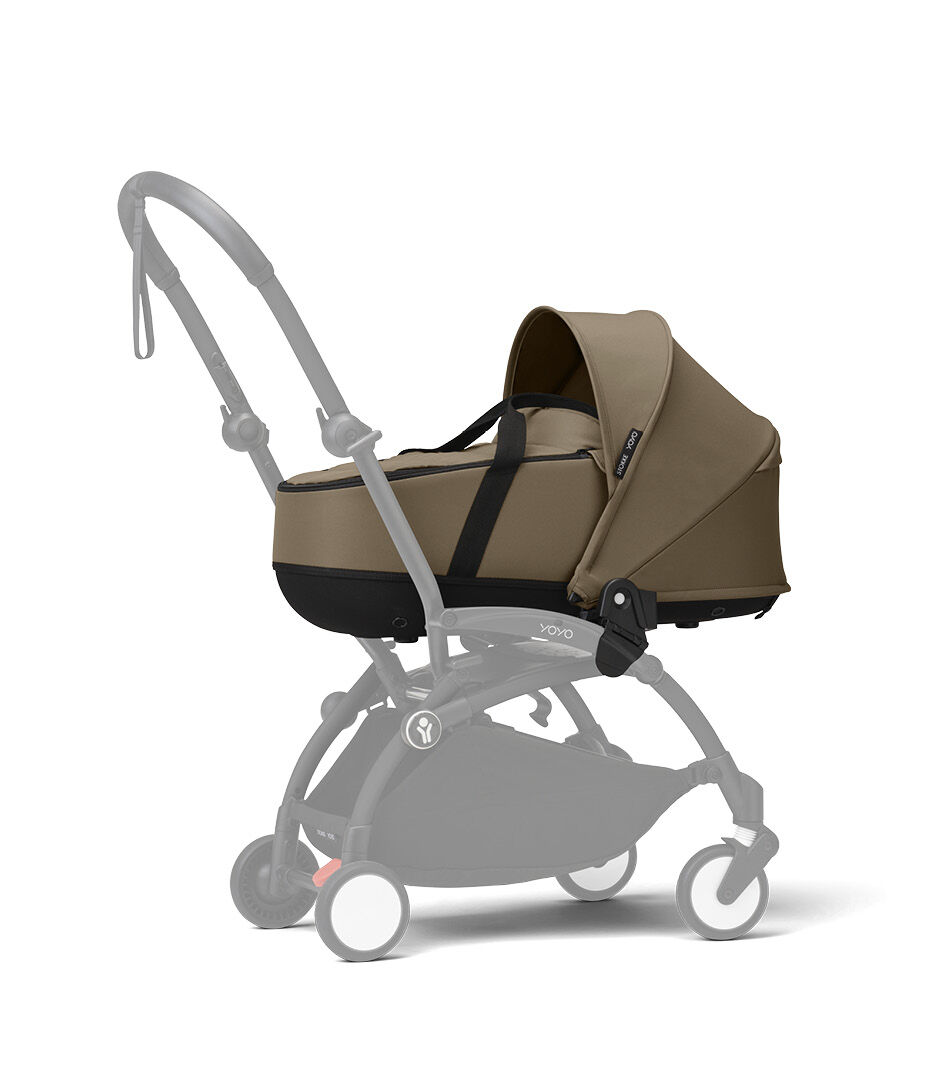 Stokke® YOYO3® Newborn Shell. Toffee. Black Frame. Shadowed frame.
