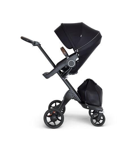 Stokke® Xplory® wtih Black Chassis and Leatherette Brown handle. Stokke® Stroller Seat Black. view 2