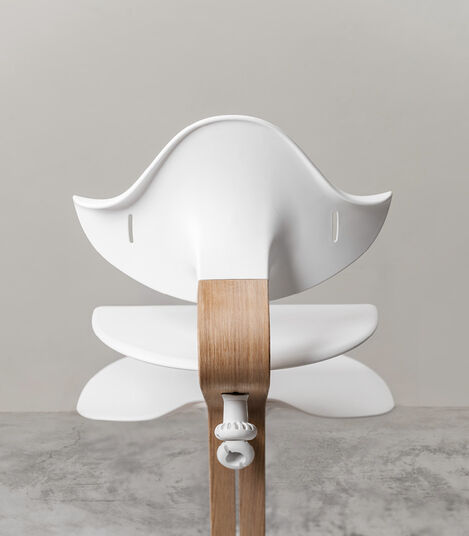 Stokke® Nomi® Chair. Oak premium wood and White plastic parts. Styled. view 6