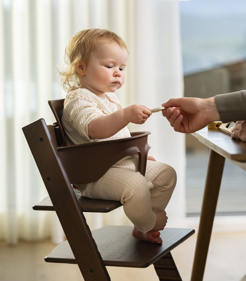 Tripp Trapp® Oak Warm Brown with Baby Set.