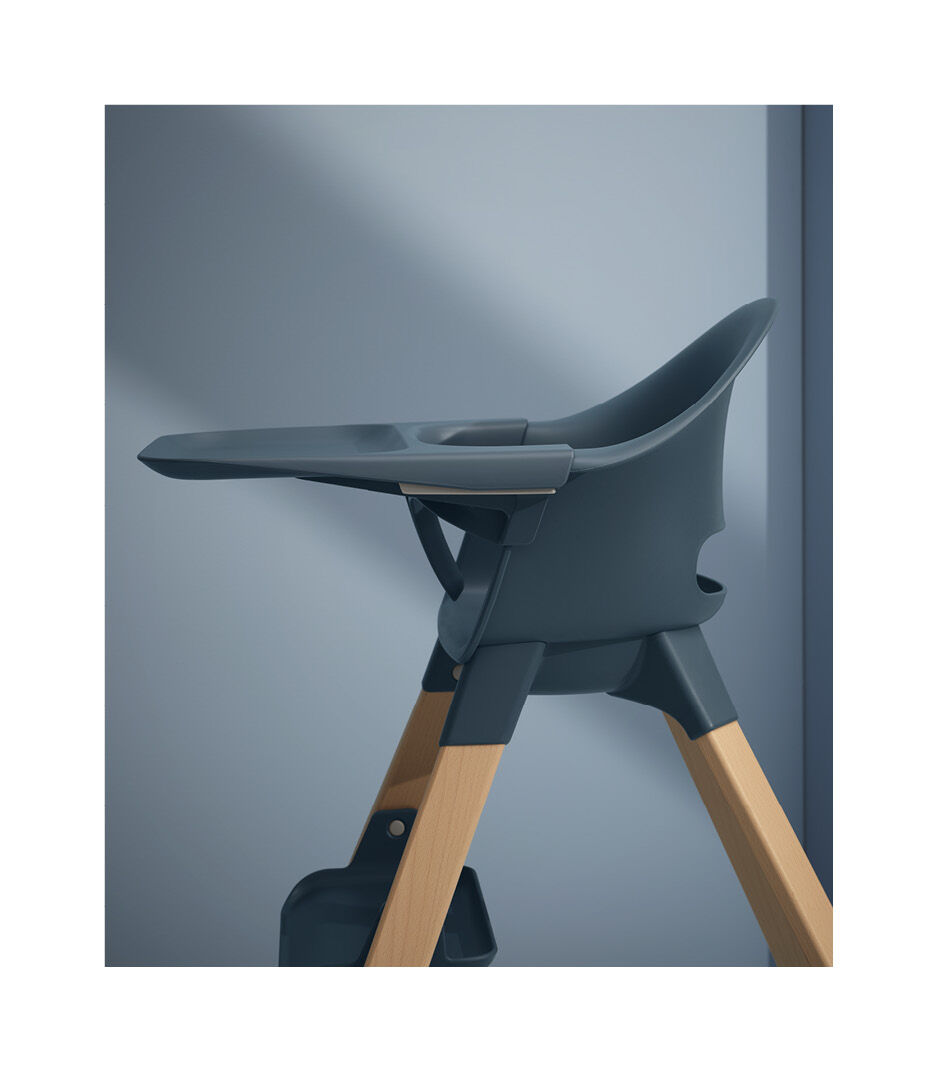 Stokke® Clikk™ High Chair. Fjord Blue with Natural Beech legs. Styled.