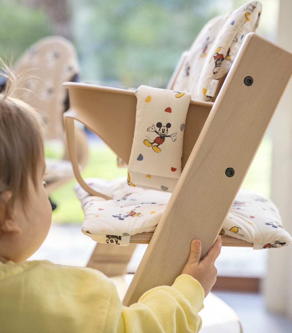 Tripp Trapp® High Chair, Natural. Disney Mickey Celebration Cushion. Close-up.