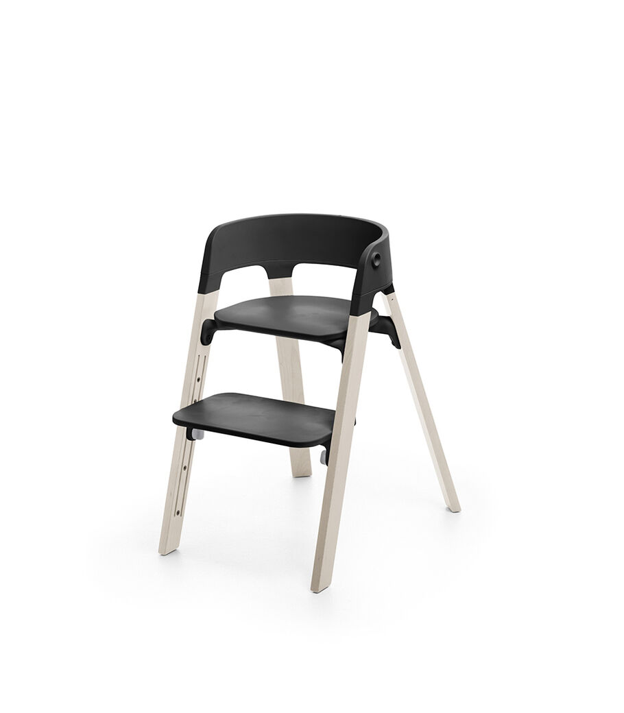 Stokke&reg; Steps&trade; Whitewash with Black seat and footrest in high position.
