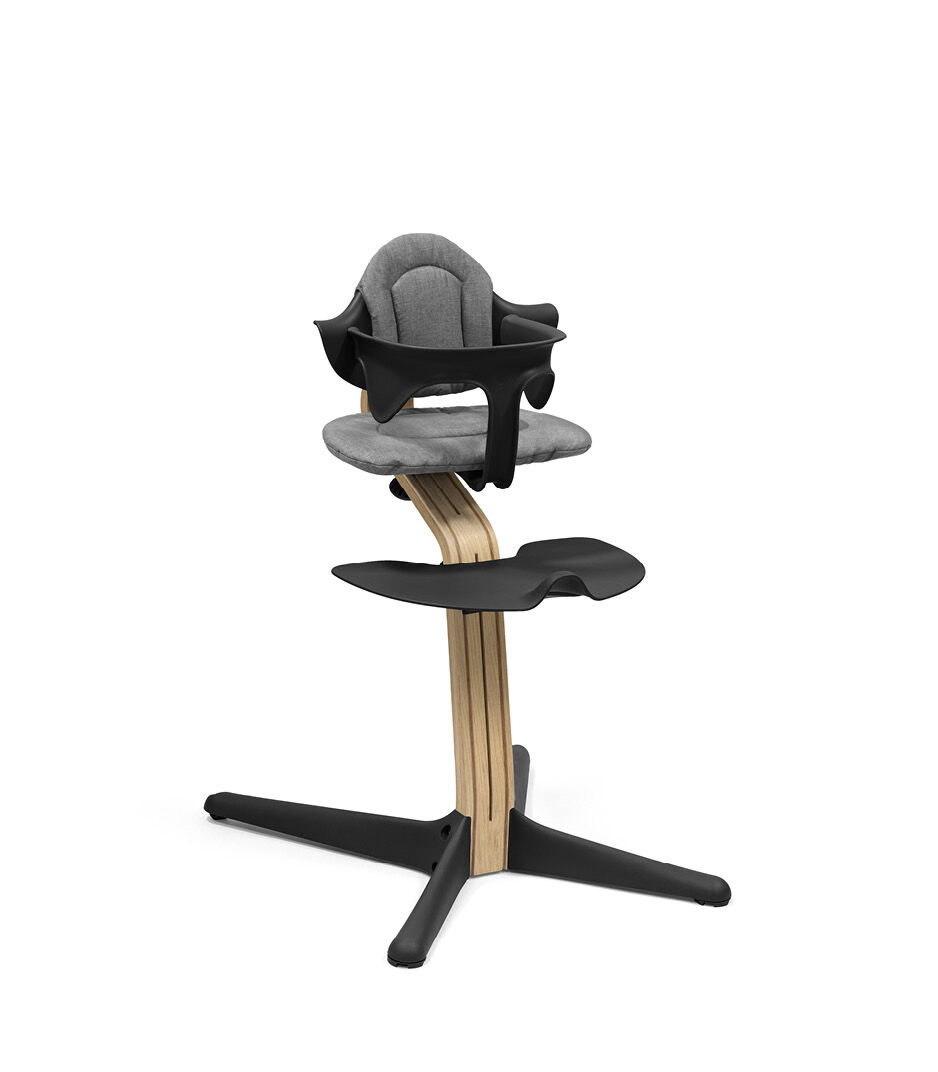 Stokke® Nomi® Chair. Premium Oak wood and Black plastic parts. With Baby Set Black.