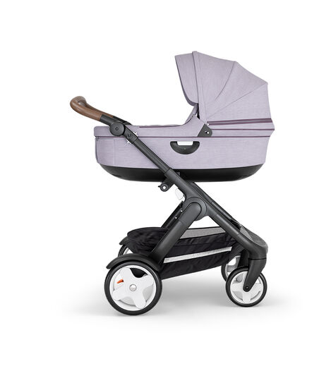 Stokke® Trailz™ with Black Chassis, Brown Leatherette and Classic Wheels. Stokke® Stroller Carry Cot, Brushed Lilac. view 2
