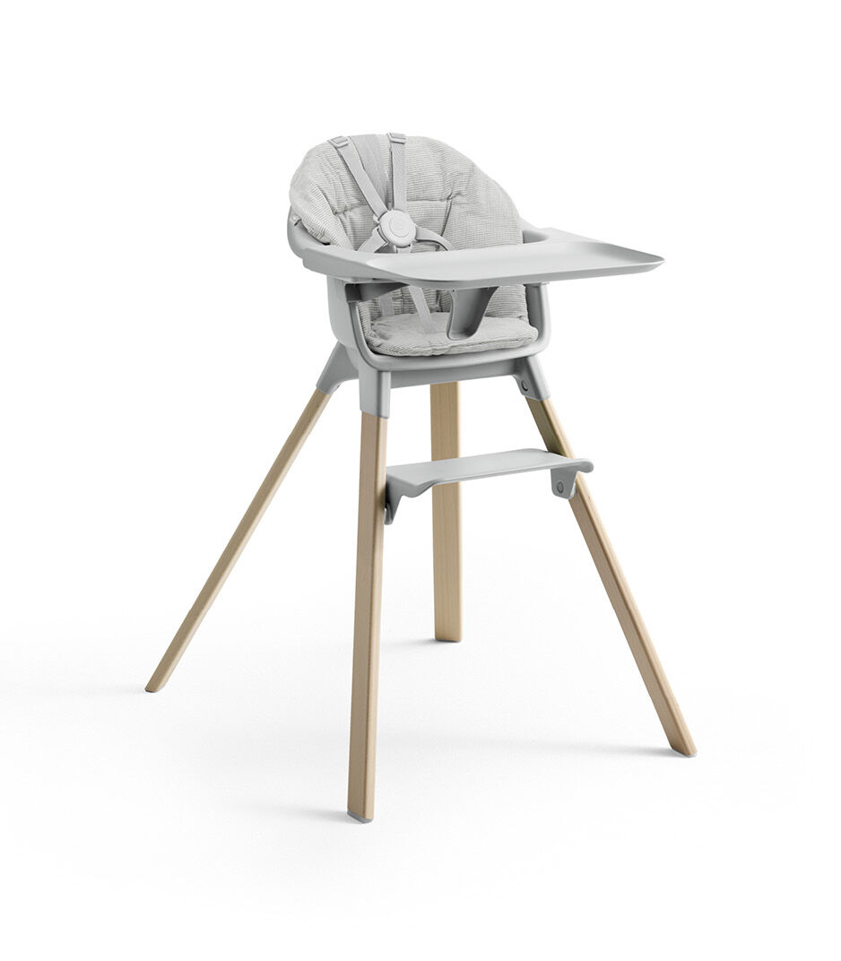 Stokke® Clikk™ High Chair with Tray and Harness, in Natural and Cloud Grey. Cushion Nordic Grey.
