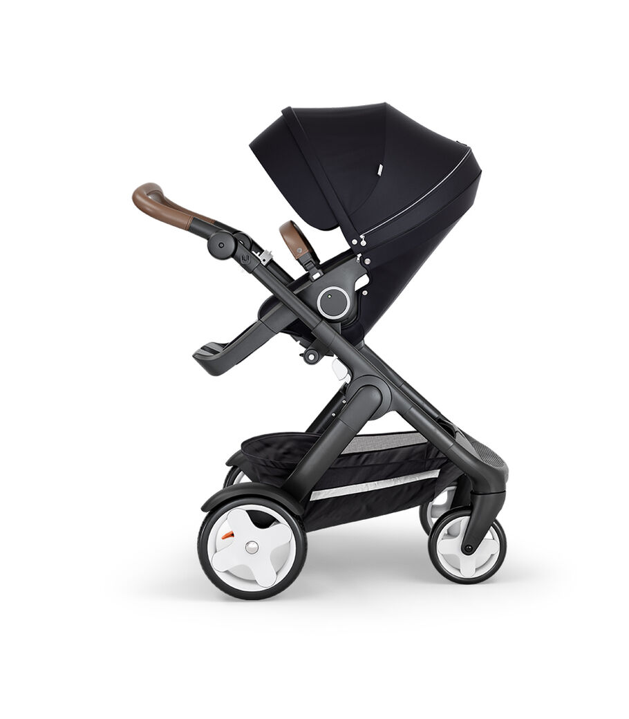Stokke&reg; Trailz&trade; with Black Chassis, Brown Leatherette and Classic Wheels. Stokke&reg; Stroller Seat, Black.