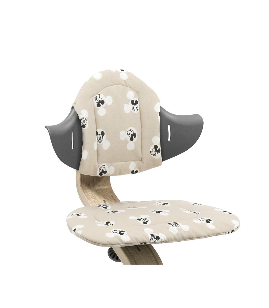 Stokke® Nomi® Chair Natural-Grey with Disney Cushion Mickey Signature. Close-up. Limited Edition.