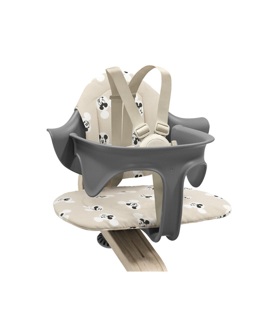 Stokke® Nomi® Chair Natural-Grey with Baby Set and Disney Cushion Mickey Signature. US variant. Limited Edition.
