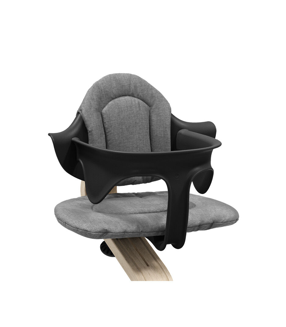Stokke® Nomi® Chair Natural-Black with Baby Set and Grey Cushions. Close-up.
