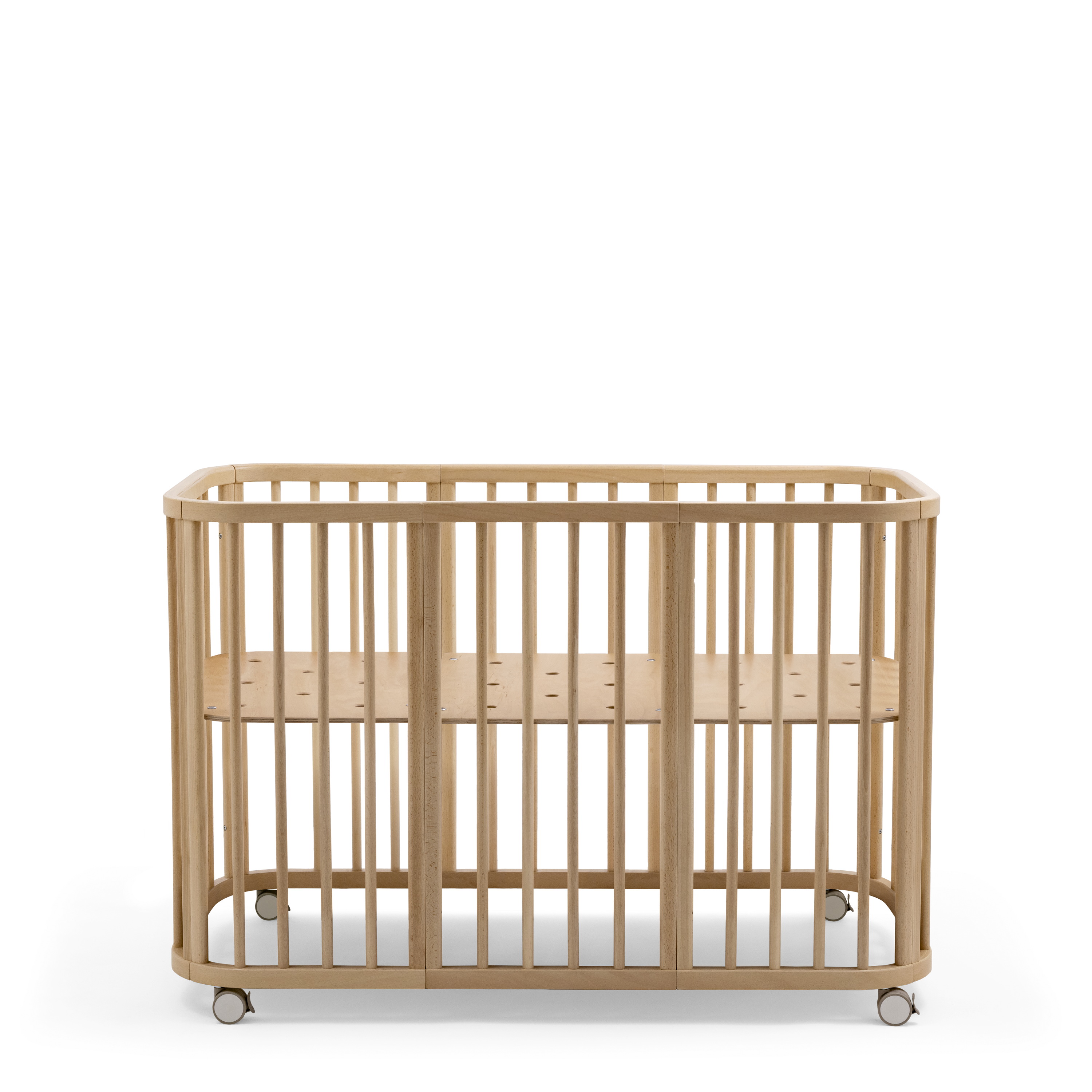 Stokke® Nighti™ Bed. Basic. Natural. Bed bottom high level. Wheels Beige. Profile view. galery image 16