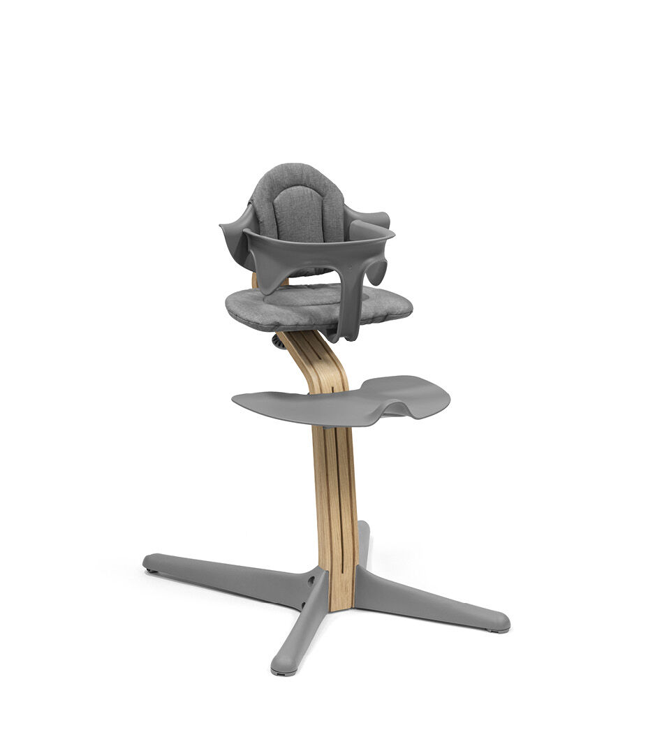 Stokke® Nomi® Chair. Premium Oak wood and Grey plastic parts. With Baby Set Grey and Cushion Grey.