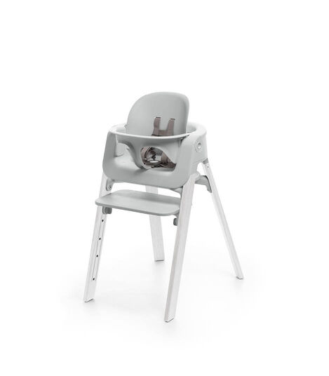 Stokke&reg; Steps&trade; Oak White chair with Baby Set Light Grey.