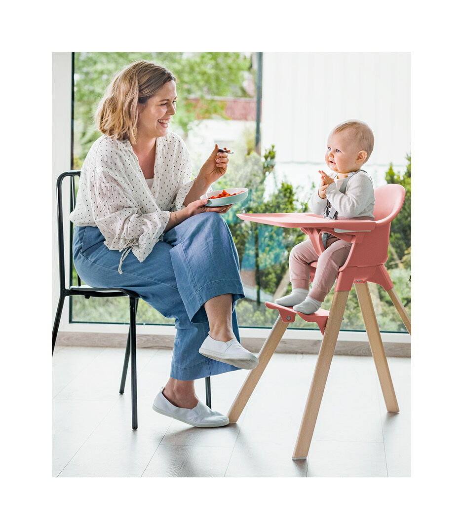 Stokke® Clikk™ High Chair. Natural Beech wood. Sunny Coral plastic parts.