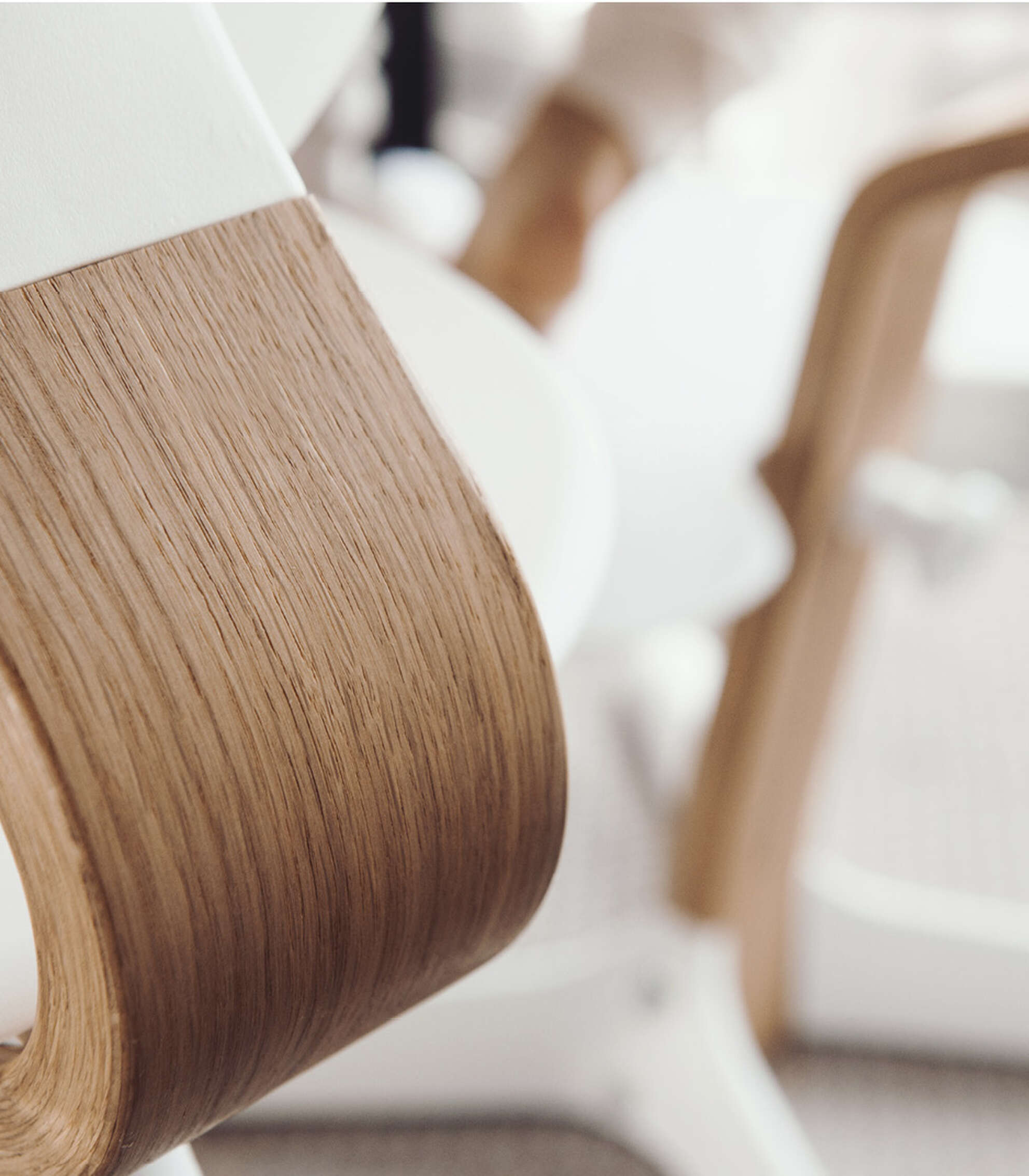 Close-up of wooden slats forming chair leg/arm.