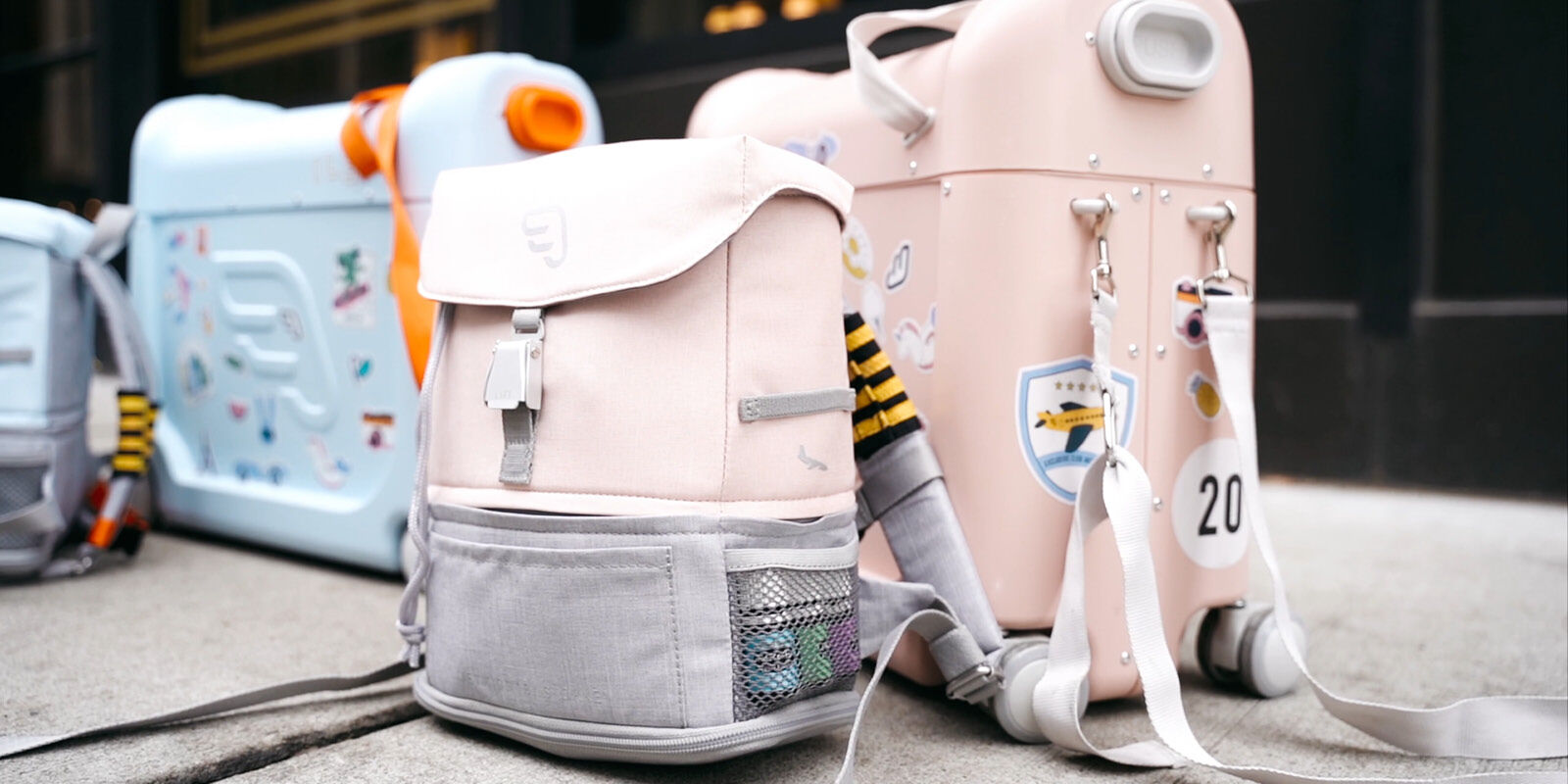 JetKids&trade; by Stokke&reg; in setting. On the move. Bundle with BedBox and Crew BackPack. Pink Lemonade and Blue Sky.