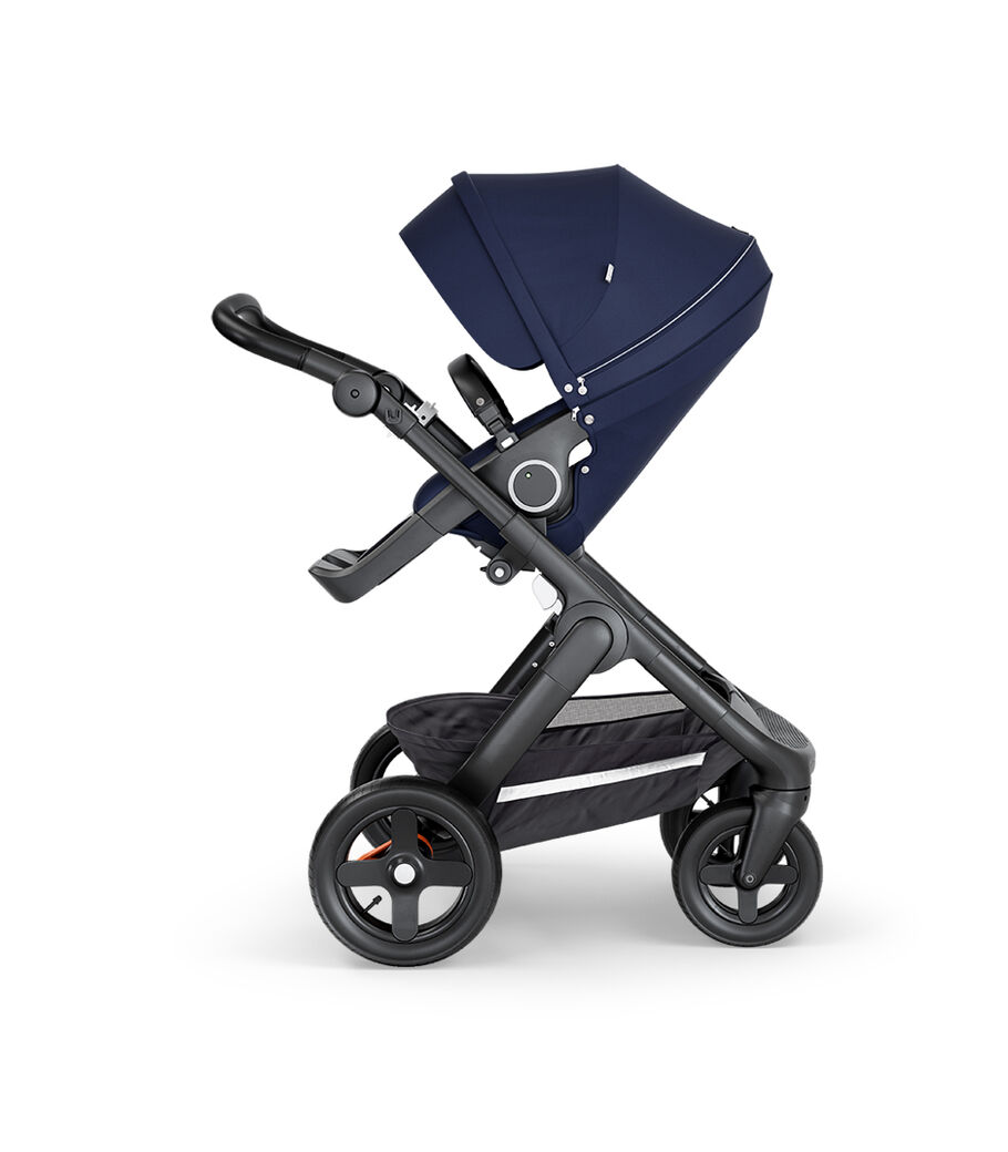 Stokke&reg; Trailz&trade; with Black Chassis, Black Leatherette and Terrain Wheels. Stokke&reg; Stroller Seat, Deep Blue.