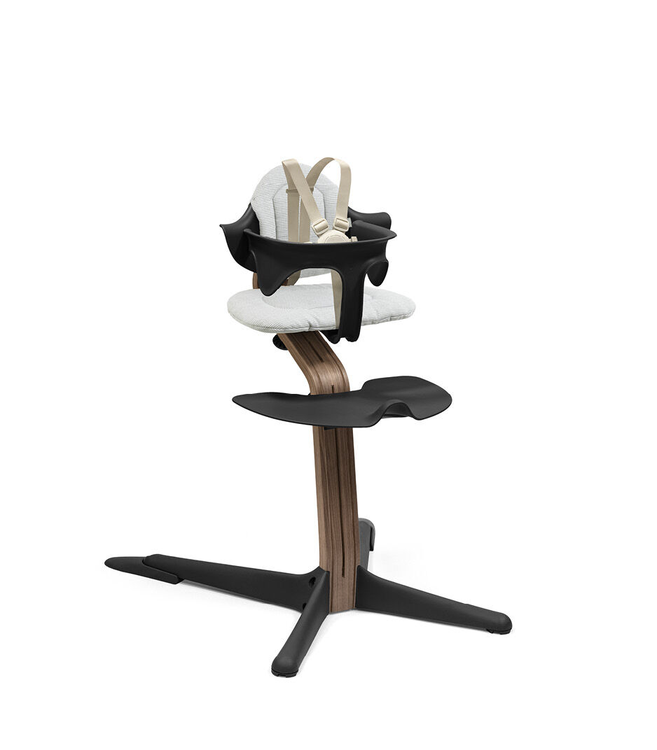 Stokke® Nomi® Chair. Premium Walnut wood and Black plastic parts. With Baby Set, Black. Cushion Nordic Grey. US variant with harness and leg extensions. galery image 3