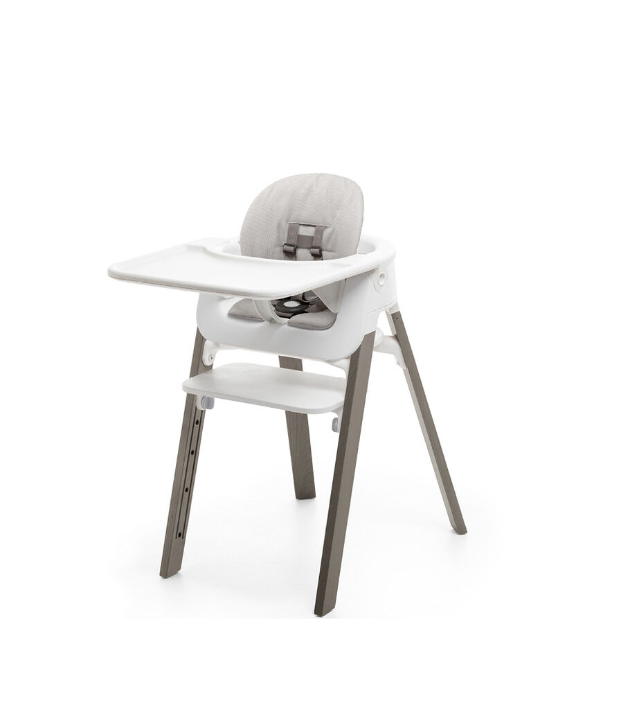 Stokke® Steps™ Hazy Grey with Accessories. Baby Set White. Baby Set Cushion Timeless Grey. Baby Set Tray White. view 4