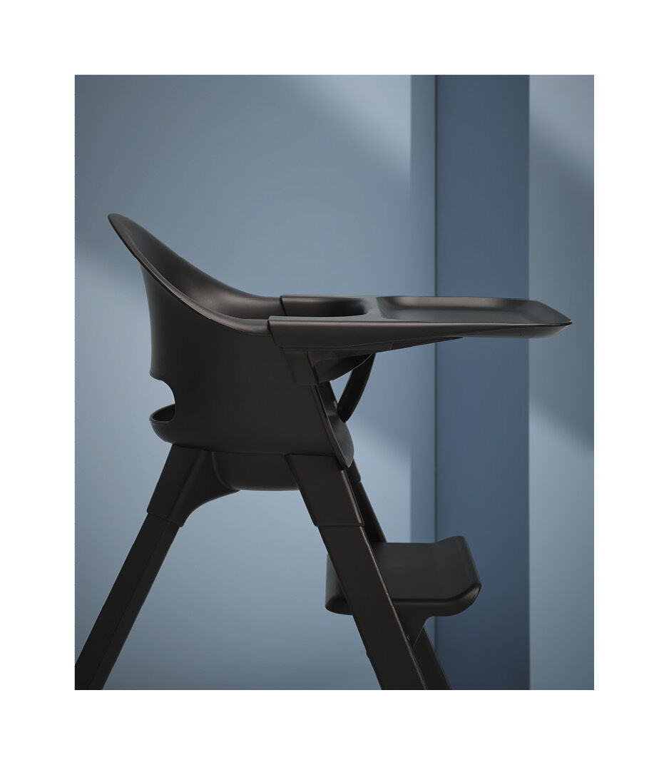 Stokke® Clikk™ High Chair. Midnight Black. Black with Black Beech legs. Styled.