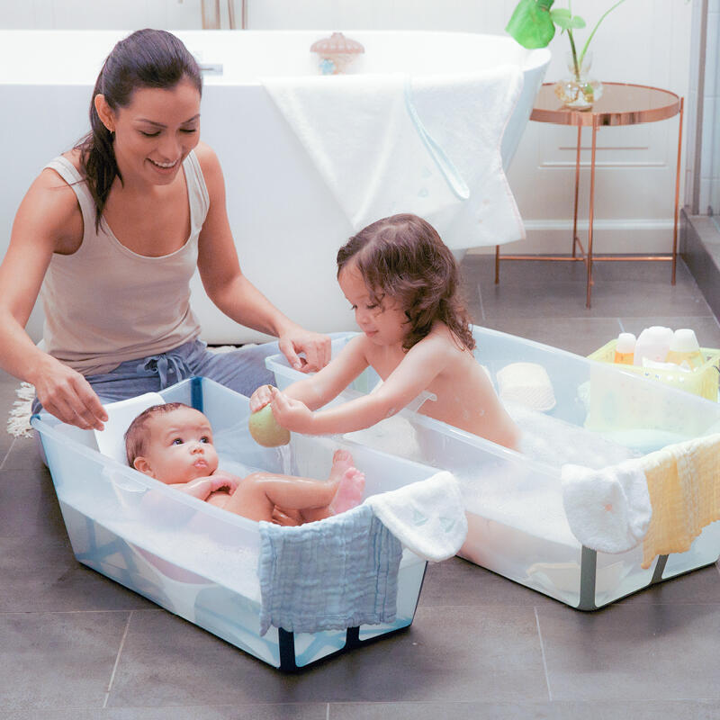 Family during bath time using their Flexi Bath® XL and Flexi Bath® with Newborn Support.