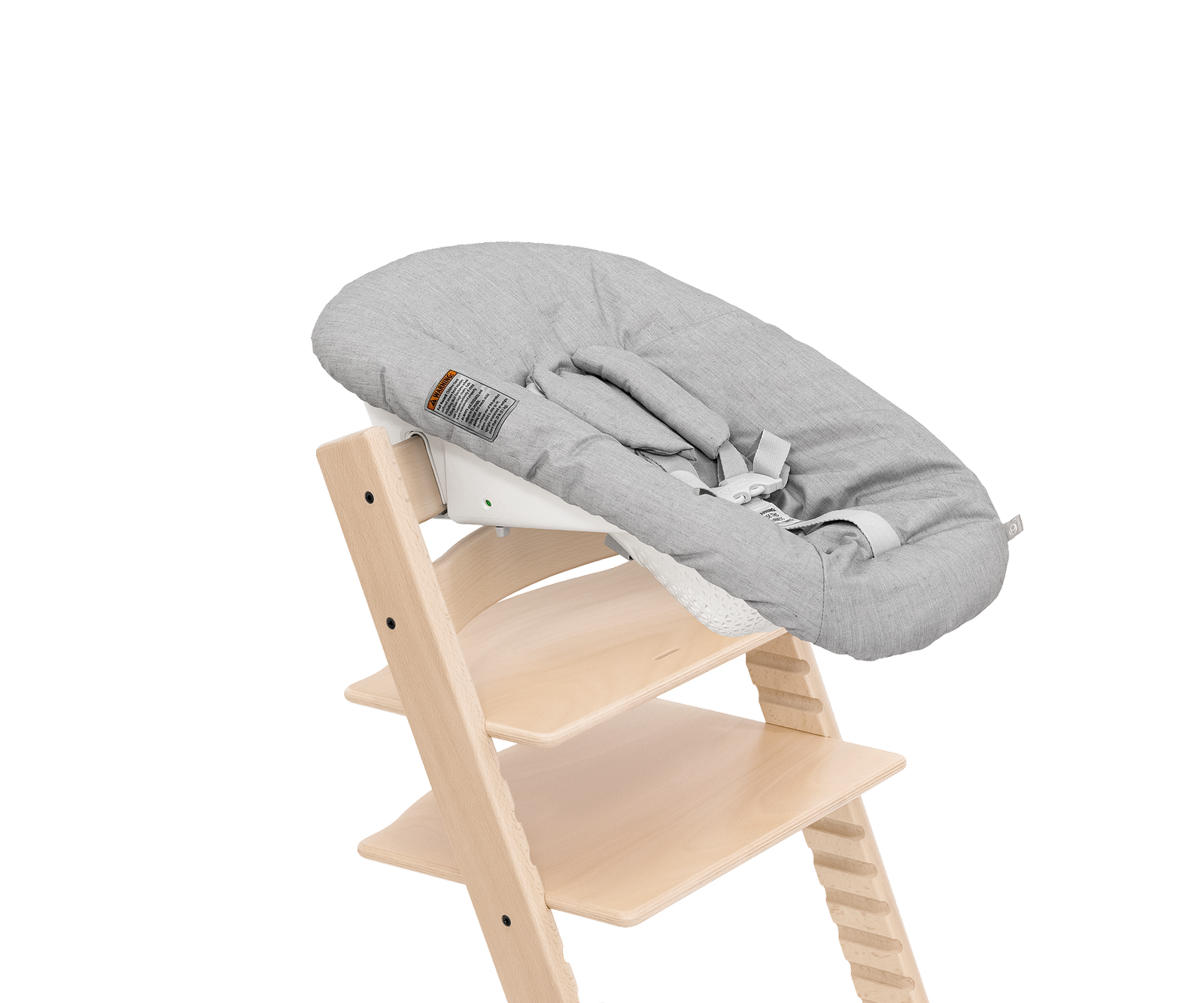 Stokke Tripp Trapp high chair with a gray padded Newborn Set on a black background.