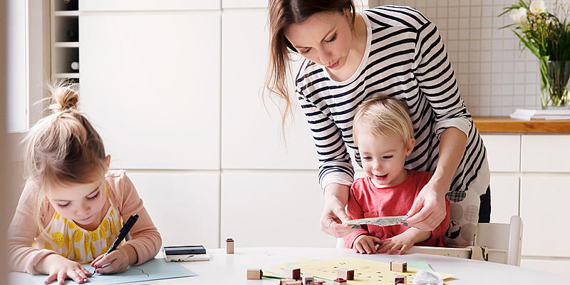 Mother playing with 2 kids