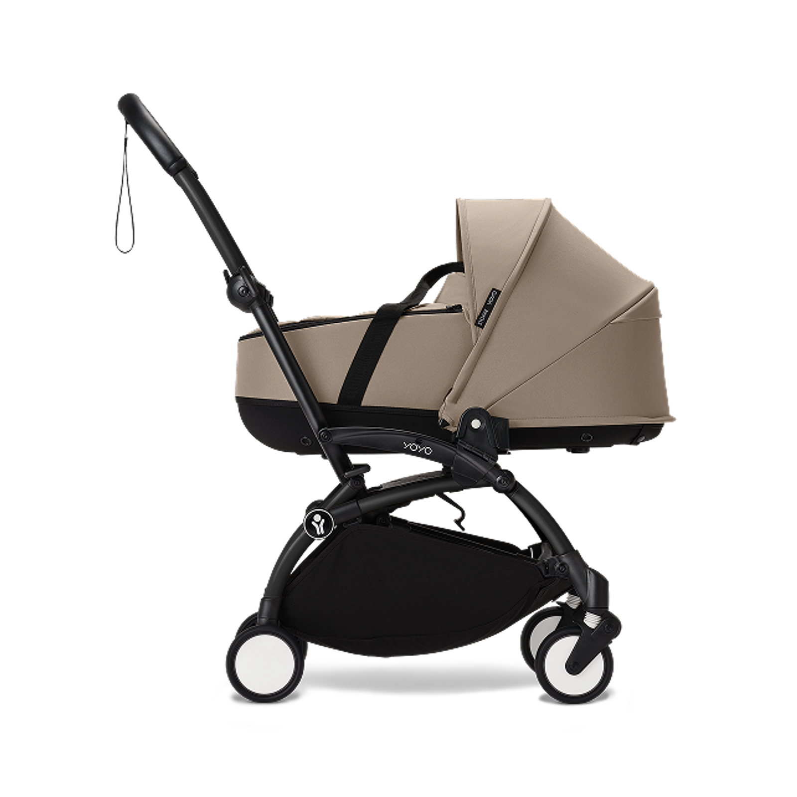 A beige STOKKE YOYO stroller with a black frame and carrycot attachment.